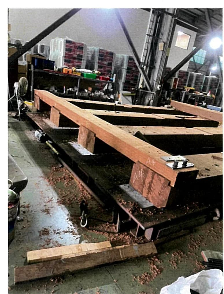 Timber work in the shop: large hardwood baulks cut to size and dressed flat.