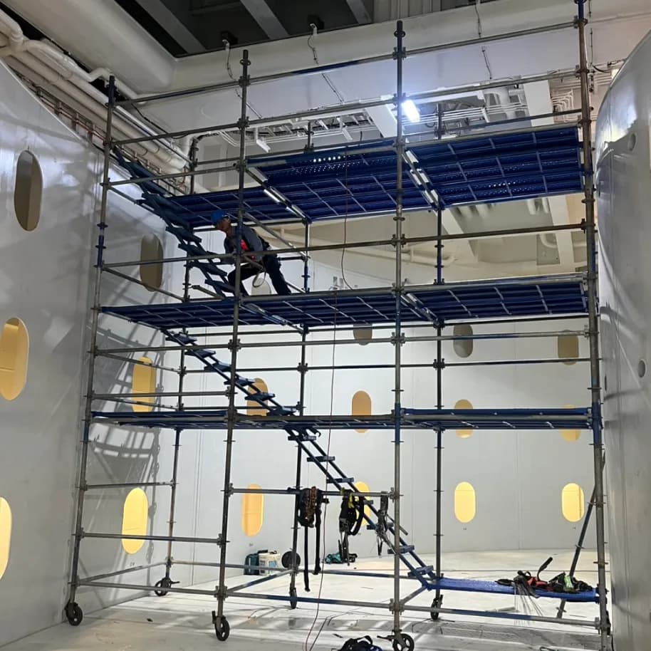 Erecting Access Scaffolding for Overhead Work in a Compartment